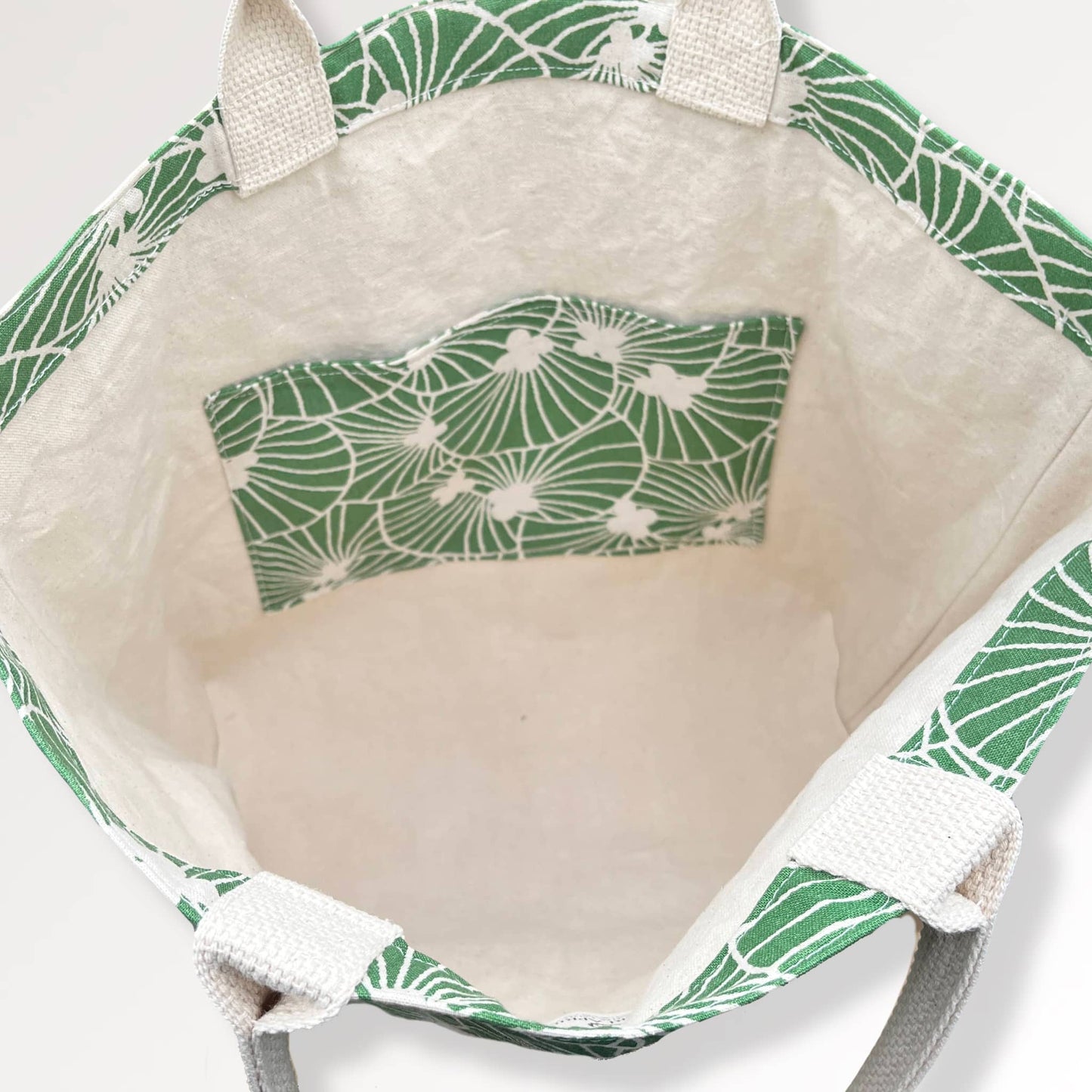 Green and Ivory Desert Escape Tote Bag, reflecting the spacious interior and impeccable craftsmanship.